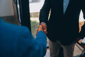 Business handshake for teamwork of business merger and acquisition,successful negotiate,hand shake,two businessman shake hand with partner to celebration partnership and business deal concept photo