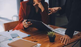 Entrepreneurs and business people conference in modern meeting room, happy multiracial coworkers have fun cooperating working together at office meeting, asian teamwork concept photo