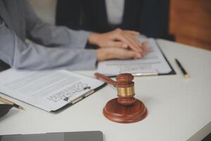 Lawyer, legal advisor, businessman brainstorming information on agreement details Business contracts in legal processing books for accuracy in contract documents. joint financial investment. photo