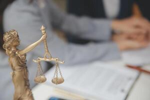 Lawyer, legal advisor, businessman brainstorming information on agreement details Business contracts in legal processing books for accuracy in contract documents. joint financial investment. photo