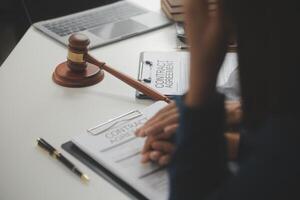 Lawyer, legal advisor, businessman brainstorming information on agreement details Business contracts in legal processing books for accuracy in contract documents. joint financial investment. photo