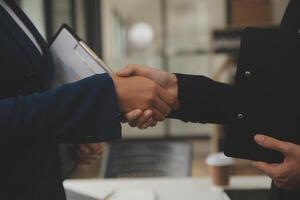 Business handshake for teamwork of business merger and acquisition,successful negotiate,hand shake,two businessman shake hand with partner to celebration partnership and business deal concept photo