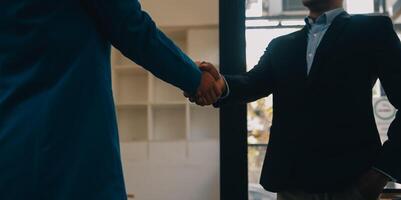 Business handshake for teamwork of business merger and acquisition,successful negotiate,hand shake,two businessman shake hand with partner to celebration partnership and business deal concept photo