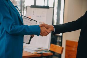 Business handshake for teamwork of business merger and acquisition,successful negotiate,hand shake,two businessman shake hand with partner to celebration partnership and business deal concept photo