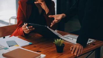 Entrepreneurs and business people conference in modern meeting room, happy multiracial coworkers have fun cooperating working together at office meeting, asian teamwork concept photo