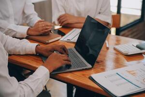 Entrepreneurs and business people conference in modern meeting room, happy multiracial coworkers have fun cooperating working together at office meeting, asian teamwork concept photo