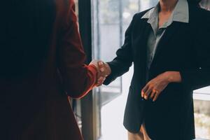 Businesswoman handshake and business people. Successful business handshake concept. photo