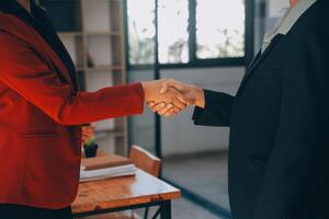 Businesswoman handshake and business people. Successful business handshake concept. photo