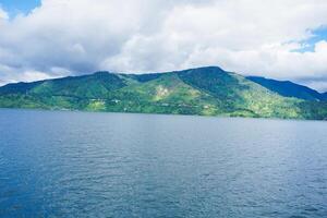 View of Lake Toba and the hills when seen from the ferry photo
