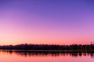 Serene Waters A Blissful Reflection of a Beautiful Pastel Lake and Sky, Where Tranquility Meets Nature's Palette, Creating a Harmonious Oasis of Soft Hues and Ethereal Beauty photo