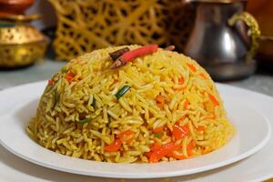 Embark on a Culinary Journey with the Exquisite Aroma and Flavorful Bliss of Kebuli Rice, a Fragrant Middle Eastern Dish Infused with Spices and Savory Perfection, Offering Gastronomic Joy. photo