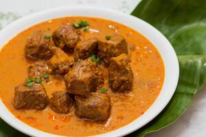 Savor the Exquisite Lamb or Beef Curry Rendang, Ready to Be Relished on Eid al-Adha, Capturing the Essence of Celebration in a Perfect Photo, Showcasing Culinary Mastery and Festive Indulgence photo