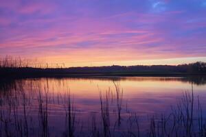 Serene Waters A Blissful Reflection of a Beautiful Pastel Lake and Sky, Where Tranquility Meets Nature's Palette, Creating a Harmonious Oasis of Soft Hues and Ethereal Beauty photo