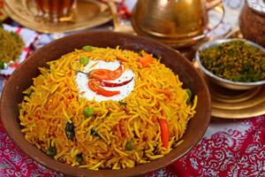 Embark on a Culinary Journey with the Exquisite Aroma and Flavorful Bliss of Kebuli Rice, a Fragrant Middle Eastern Dish Infused with Spices and Savory Perfection, Offering Gastronomic Joy. photo