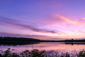 Serene Waters A Blissful Reflection of a Beautiful Pastel Lake and Sky, Where Tranquility Meets Nature's Palette, Creating a Harmonious Oasis of Soft Hues and Ethereal Beauty photo