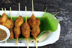 Indulge in the Beauty of Beautiful Satay, Where Skewers of Marinated Delight are Char-Grilled to Golden Perfection, Offering a Symphony of Flavor in Every Bite, a Culinary Artistry to Savor photo