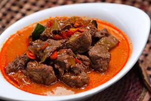Savor the Exquisite Lamb or Beef Curry Rendang, Ready to Be Relished on Eid al-Adha, Capturing the Essence of Celebration in a Perfect Photo, Showcasing Culinary Mastery and Festive Indulgence photo