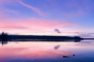 Serene Waters A Blissful Reflection of a Beautiful Pastel Lake and Sky, Where Tranquility Meets Nature's Palette, Creating a Harmonious Oasis of Soft Hues and Ethereal Beauty photo