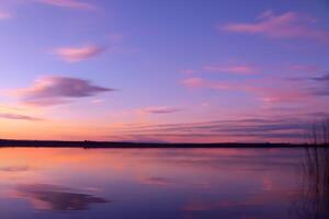 Serene Waters A Blissful Reflection of a Beautiful Pastel Lake and Sky, Where Tranquility Meets Nature's Palette, Creating a Harmonious Oasis of Soft Hues and Ethereal Beauty photo