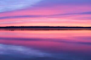 Serene Waters A Blissful Reflection of a Beautiful Pastel Lake and Sky, Where Tranquility Meets Nature's Palette, Creating a Harmonious Oasis of Soft Hues and Ethereal Beauty photo