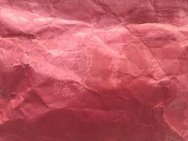 crumpled red paper paint or red paper background or texture photo