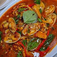 Stir-fried Clams with Chilli Paste on plate, Thai Food photo