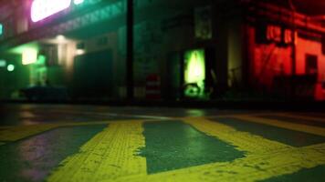 A yellow arrow painted on the ground in front of a building video