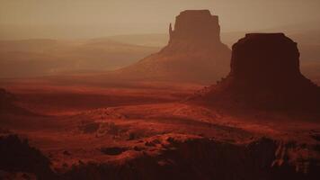 A majestic rock formation rising from the barren desert landscape video