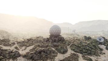 A massive surveillance antenna standing alone in the vastness of the desert video