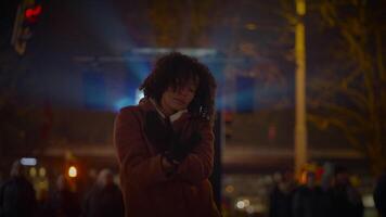 Happy Young Woman with Curly Hair Dancing Outside in the City Night Lights video