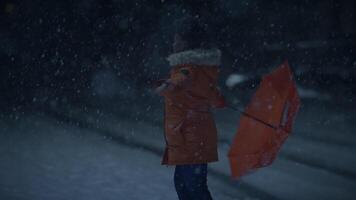 African Woman With Afro Hairstyle In Organge Clothes Outside Dancing in Snowfall video