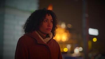 Happy Young Woman with Curly Hair Dancing Outside in the City Night Lights video