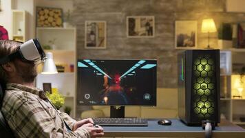 Game over for adult man playing video games using vr headset. Woman sitting on sofa watching tv in the background.