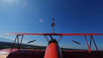 A red light aircraft takes off from a field video