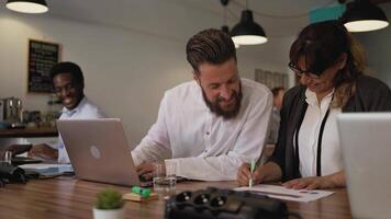 Business team of diverse people working together inside modern office video