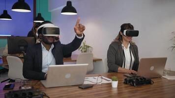 a group of office workers wearing virtual reality headset in an office video