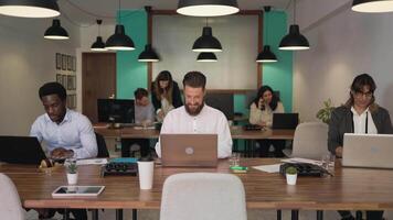 Business team of diverse people working together inside modern office video