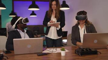 a group of office workers wearing virtual reality headset in an office video