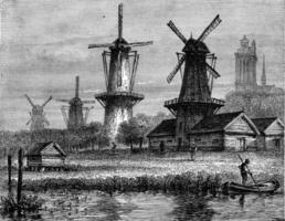 Windmills in Dordrecht, Holland, vintage engraving. photo