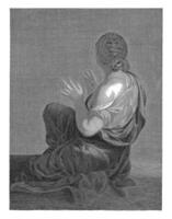 Seated woman seen from her back photo