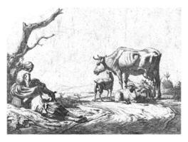 pastor y pastora con vacas foto