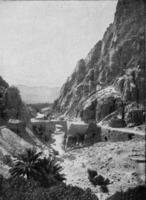 The El Kantara Gorge at the edge of the Sahara, vintage engraving. photo