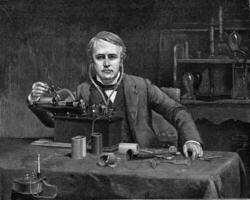 Thomas Alva Edison in front of his phonograph, vintage engraving. photo