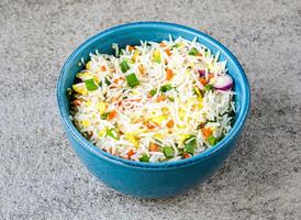 Egg Fried Rice served in bowl isolated on background top view of asian food photo