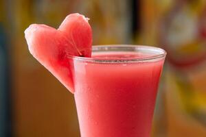 Water Melon Juice served in disposable glass isolated on table top view of arabian food photo