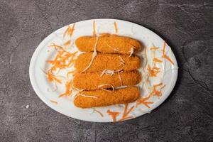 Fried Fish Fish sticks served in dish isolated on background top view of bangladesh food photo