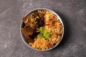 Hydrabadi Dum mutton Biriyani served in dish isolated on background top view of bangladesh food photo