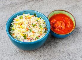 Egg fried rice with chicken manchurian served in dish isolated on background top view of asian food photo