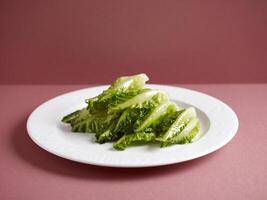 stir-fried local lettuce served in a dish isolated on mat side view on grey background photo