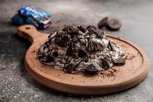 Oreo Pancake served in wooden board isolated on background top view of cafe baked food photo